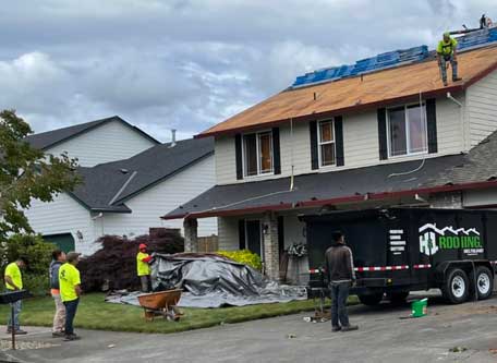 Working hard on a roof.