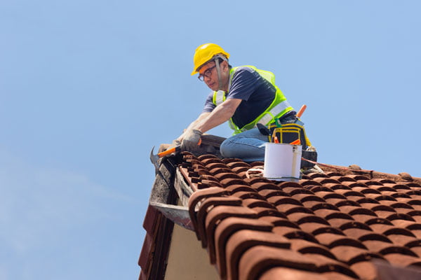 Roofer on roof.